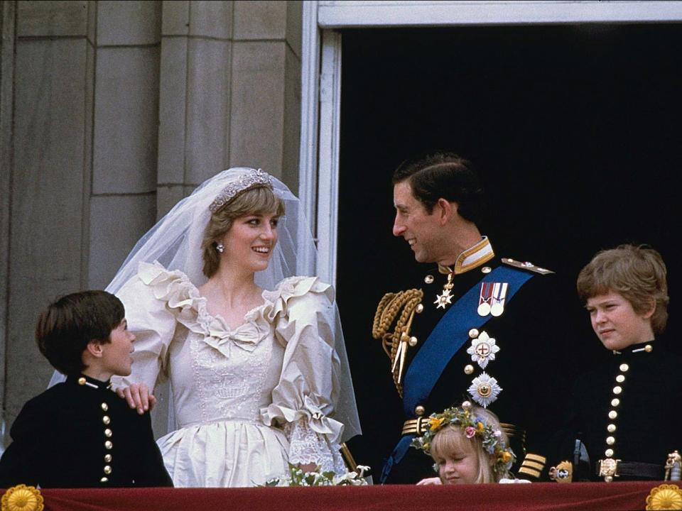 princess diana prince charles smiling at each other on their wedding day in 1981