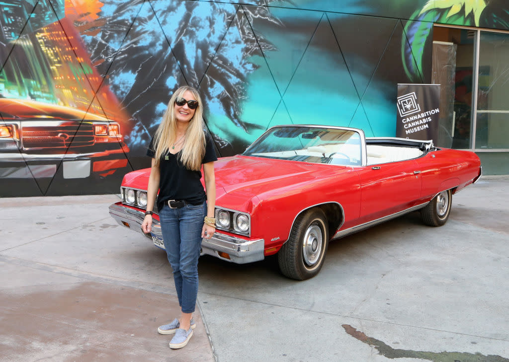 Hunter S. Thompson’s widow, Anita Thompson, poses with her late husband’s 1973 Chevrolet Caprice named the Great Red Shark at the Cannabition Cannabis Museum on August 8, 2018 in Las Vegas, Nevada. (Credit: Gabe Ginsberg via Getty Images)