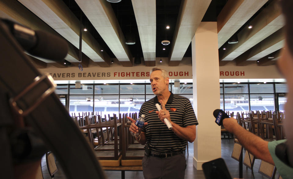 Oregon State athletic director Scott Barnes speaks inside one of the premium spaces inside renovated Reser Stadium on Tuesday, Aug. 8, 2023, in Corvallis, Ore. Oregon State is looking for stability for its teams after the college sports realignment that has destabilized the Pac-12. (AP Photo/Tim Booth)