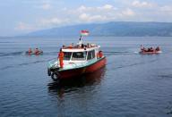 Rescuers search for missing passengers from Monday's ferry accident at Lake Toba at Tigaras port in Simalungun, North Sumatra, Indonesia, June 21, 2018. REUTERS/Beawiharta