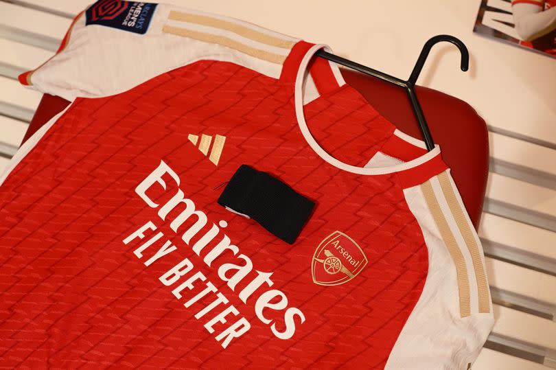 Arsenal shirt with a black armband