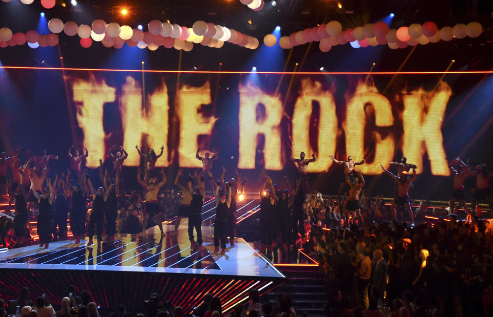 Dancers perform before Dwayne Johnson, also known as The Rock, accepts the generation award at the MTV Movie and TV Awards on Saturday, June 15, 2019, at the Barker Hangar in Santa Monica, Calif. (Photo by Chris Pizzello/Invision/AP)