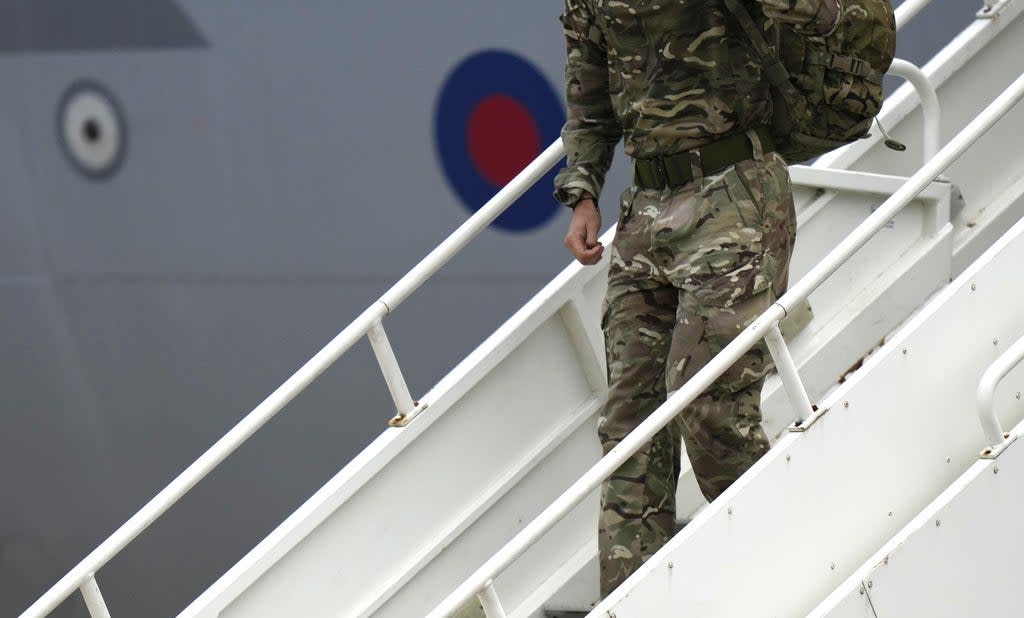 A member of the British armed forces disembarks from an RAF aircraft after returning from Kabul airport in Afghanistan (Alastair Grant/PA) (PA Wire)