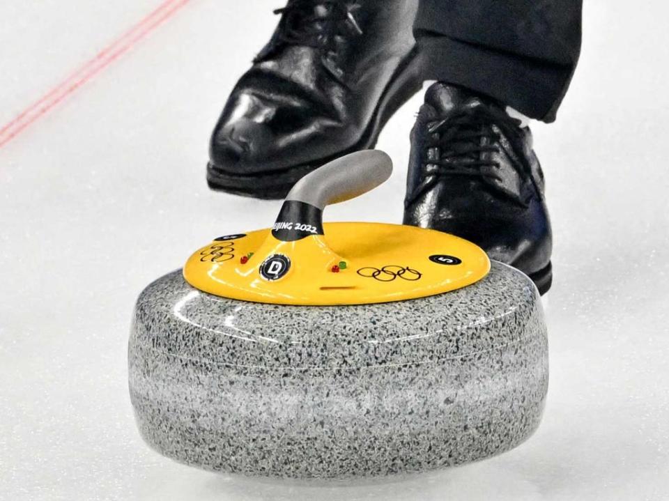 Each curling stone has a set of lights (AFP)