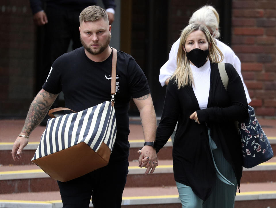 Teacher Kandice Barber, 35, leaves Aylesbury Crown Court, Buckinghamshire, with husband Daniel after being found guilty of two sex offence charges related to sending topless Snapchat pictures to a 15-year-old student. 