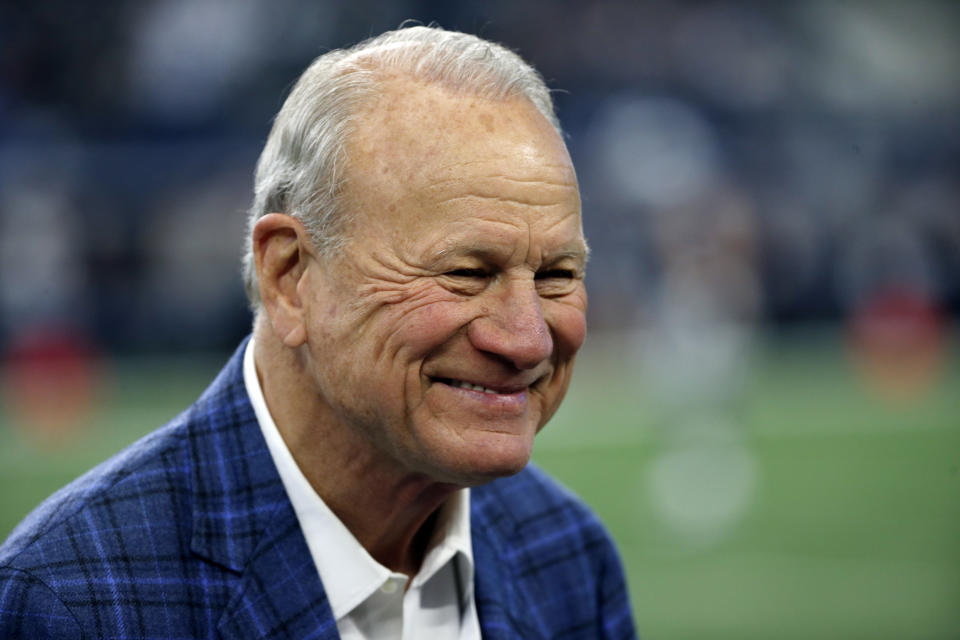 Former Dallas Cowboys coach Barry Switzer smiles as he talks with others on the field during team warm ups before an NFL football game against the Los Angeles Chargers on Thursday, Nov. 23, 2017, in Arlington, Texas. (AP Photo/Ron Jenkins)