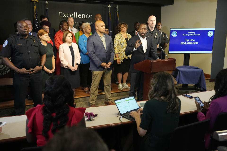 Richmond Mayor Levar Stoney, at podium, speaks during a news conference, Wednesday, June 7, 2023, in Richmond, Va., concerning the shooting at the Altria Theater after a graduation ceremony. Two people were killed and several injured in Tuesday's shooting. (AP Photo/Steve Helber)