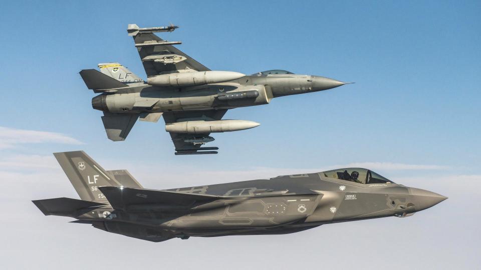 A US Air Force F-35A Joint Strike Fighter, in the foreground, flies together with an F-16C Viper in the skies over Arizona. USAF