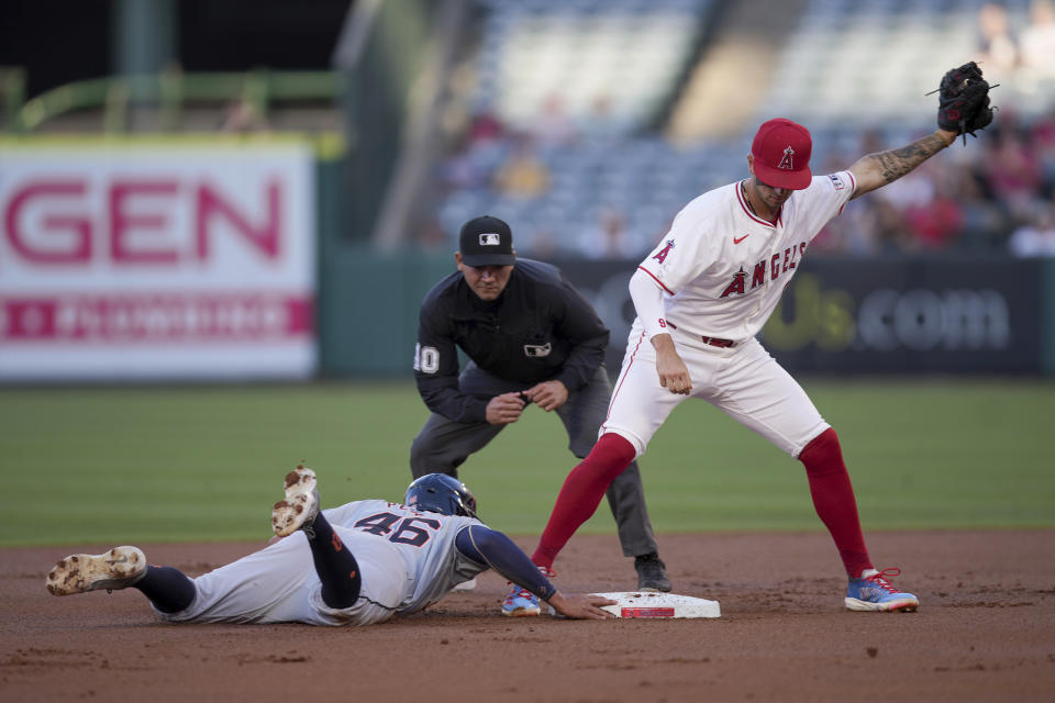 Detroit Tigers' Wenceel Perez (46) advances to second base as Los Angeles Angels shortstop Zach Neto catches the throw during the first inning of a baseball game in Anaheim, Calif., Saturday, June 29, 2024. (AP Photo/Eric Thayer)