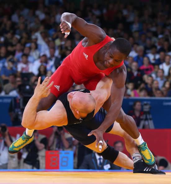 Melonin Noumonvi of France (top) competes with Rami Antero Hietaniemi of Finland during their Men's Greco-Roman 84 kg Wrestling 1/8 Final bout on Day 10 of the London 2012 Olympic Games at ExCeL on August 6, 2012 in London, England. (Photo by Cameron Spencer/Getty Images)