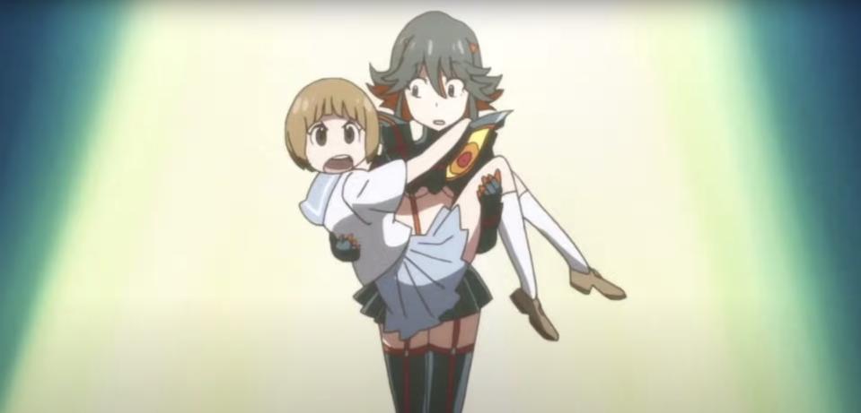Ryuko unsuspectingly carries a helpless Mako