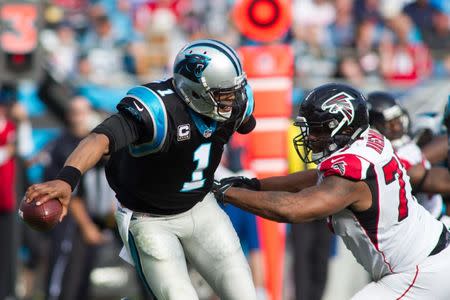 FILE PHOTO: Dec 13, 2015; Charlotte, NC, USA; Carolina Panthers quarterback Cam Newton (1) tries to avoid the sack by Atlanta Falcons defensive tackle Ra'Shede Hageman (77) during the second quarter at Bank of America Stadium. Mandatory Credit: Jeremy Brevard-USA TODAY Sports / Reuters