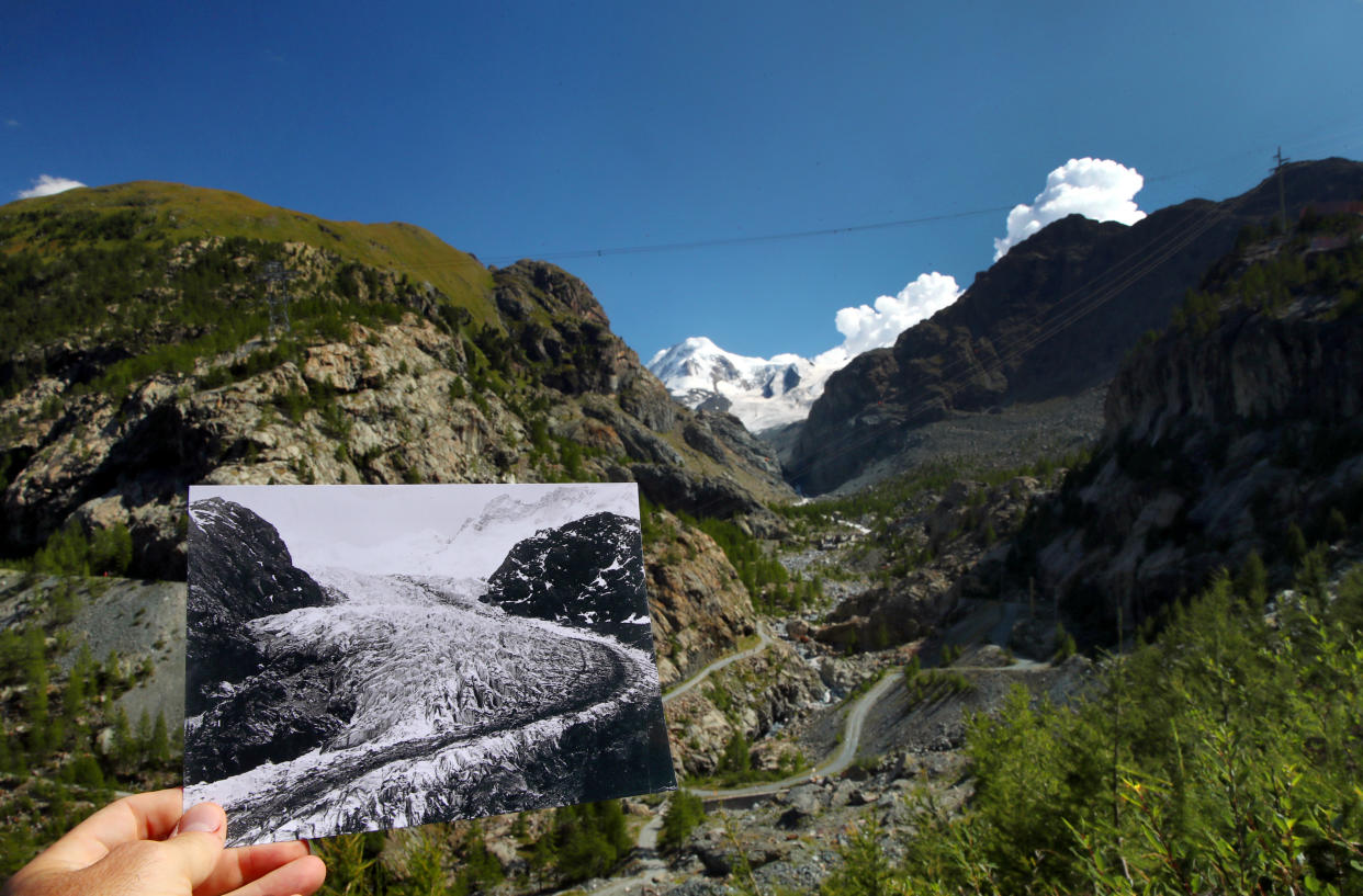 A handout picture of the Gorner Glacier taken in 1863 in Zermatt, Switzerland and released by ETH Library Zurich, is seen displayed at the same location on Aug. 25, 2019. (Photos: Denis Balibouse / Reuters,    Glaziologische Kommission der Akademie der Naturwissenschaften Schweiz/ETH Library Zurich/Handout via Reuters)