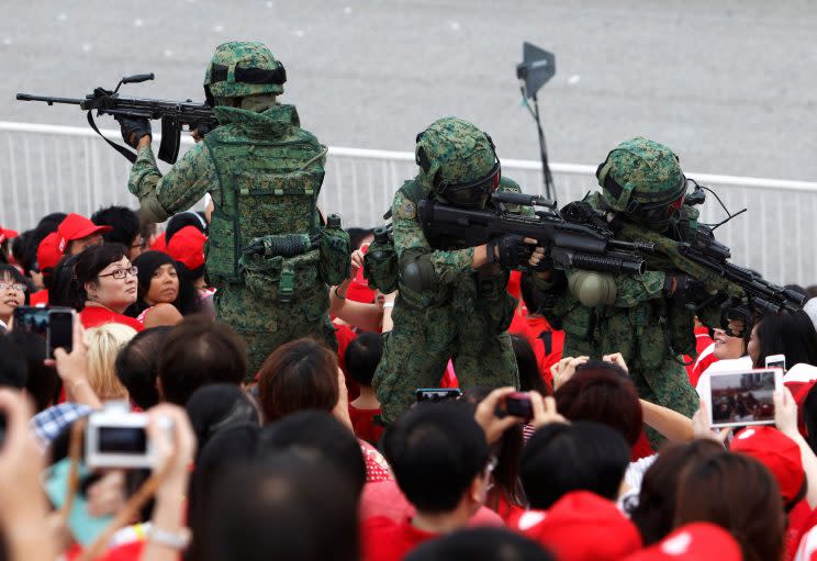 Singapore Armed Forces (SAF) personnel performing a drill during the 2013 National Day celebrations. (Photo: Reuters)