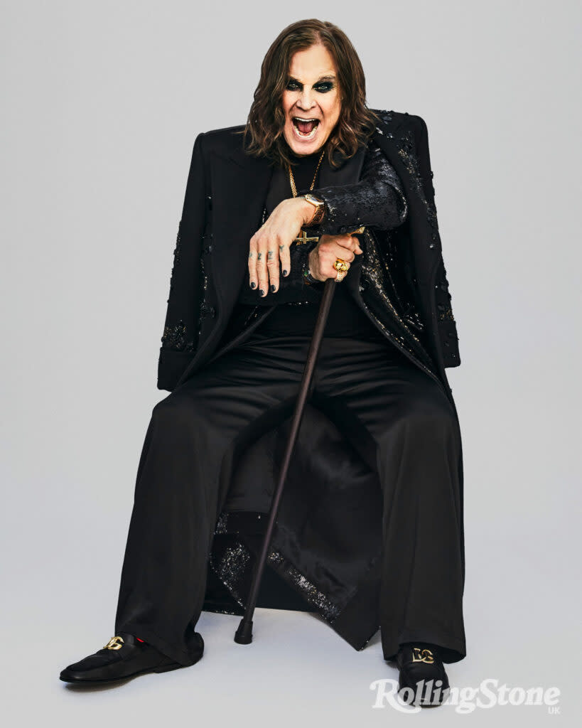 Ozzy wears shirt, trousers, coat and overcoat by Dolce & Gabbana, necklaces by Chrome Hearts, rings by Rockford Collection, bracelets by Luis Morais, watch by Cartier, holding cane by fashionable canes (Picture: Danielle Levitt)