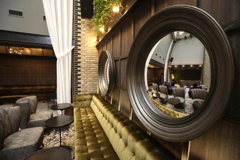 This Feb. 12, 2014, shows a lounge area reflected in a mirror adjacent to the bar area in chef Paul Kahan's restaurant Nico Osteria in Chicago. Kahan is executive chef and one of the owners of One Off Hospitality, working together with his partners _ including Donnie Madia, nominated for best restaurateur in this year’s Beard Awards _ to run seven restaurants in Chicago. He counts among his fans Anthony Bourdain and first lady Michelle Obama, and last year shared the Beard Award for best chef with New York’s David Chang, the man behind the Momofuko restaurants. (AP Photo/M. Spencer Green)