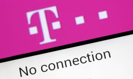 A photo illustration shows a German Deutsche Telekom logo on smartphone in front of a displayed "No connection" logo on November 28, 2016. REUTERS/Dado Ruvic/Illustration