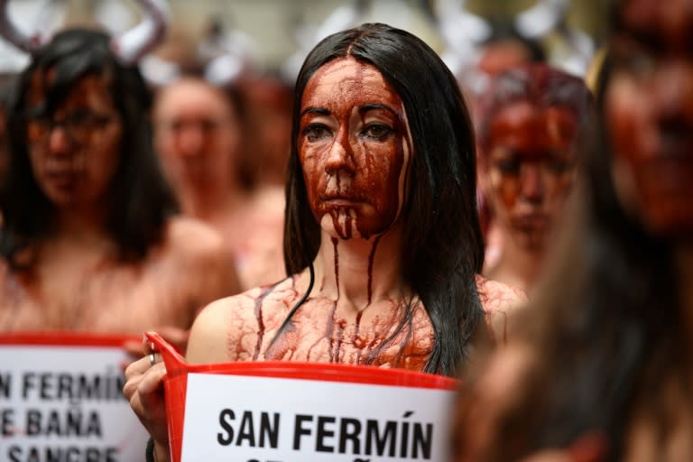 Animal rights activists daubed themselves with fake blood and stood outside of Pamplona's bullring during a protest against the festival on July 5, 2016