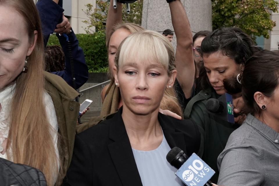 Sherri Papini leaves the federal courthouse after Federal Judge William Shubb sentenced her to 18 months in federal prison, in Sacramento, Calif., Monday, Sept. 19, 2022. Federal prosecutors had asked that she be sentenced to eight months in prison for faking her own kidnapping in 2016. (AP Photo/Rich Pedroncelli)