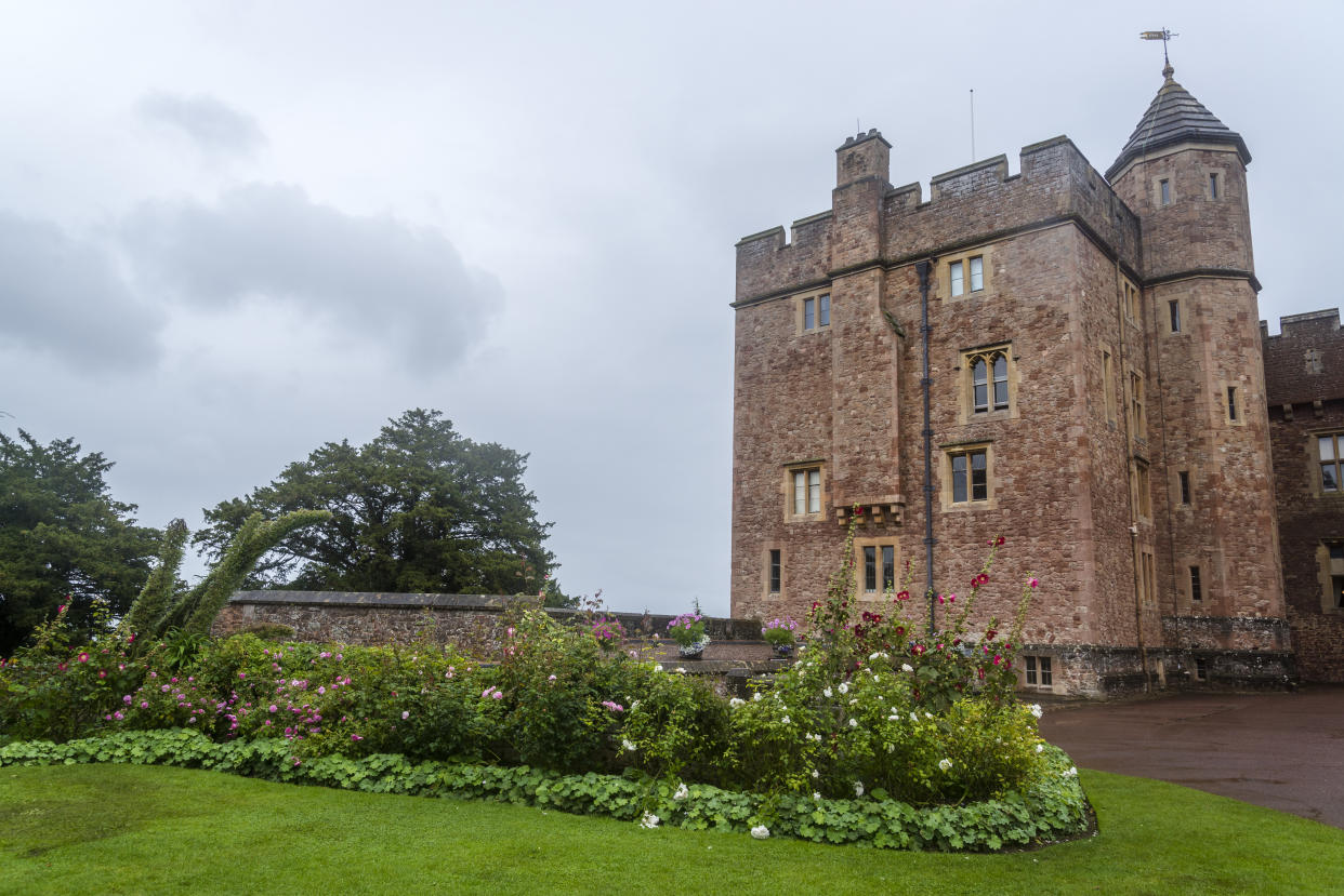 Dunster Castle is a former motte and bailey castle, now a country house, in the village of Dunster, Somerset, England UK