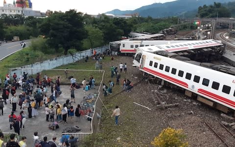 The train fell in a zig-zag shape - Credit: CNA PHOTO/AFP/Getty Images