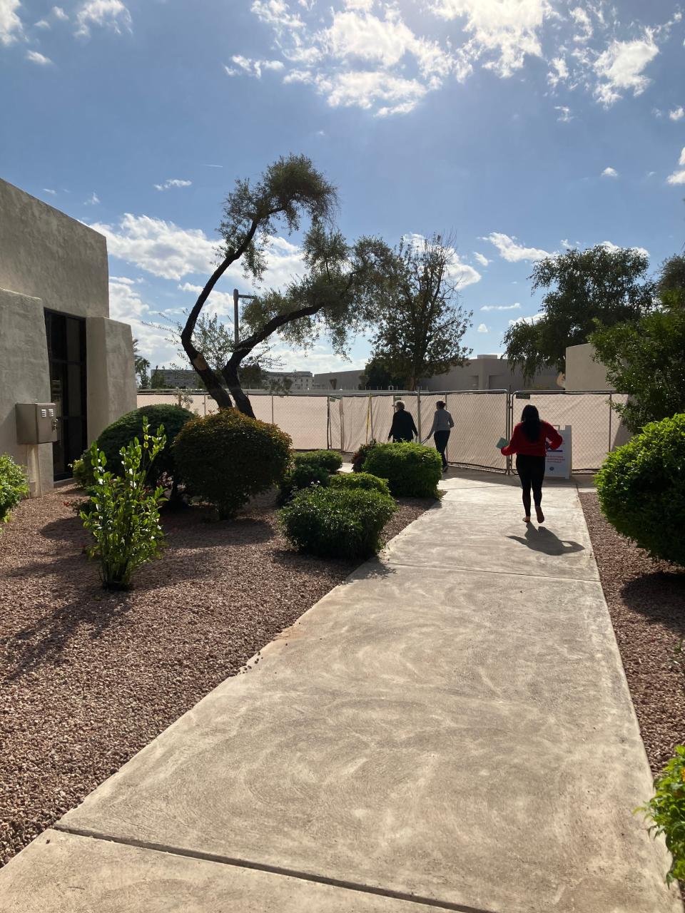 Voters walk to drop off their ballots at Scottsdale City Hall on Nov. 2, 2022.
