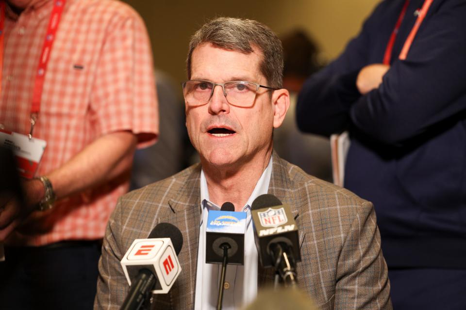 Los Angeles Chargers head coach Jim Harbaugh talks to reporters during the NFL's annual league meetings.