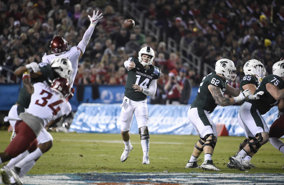 Michigan State quarterback Brian Lewerke (14) plays during the second half of the Holiday Bowl NCAA college football game against Washington State Thursday, Dec. 28, 2017, in San Diego. (AP Photo/Denis Poroy)