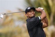 Tiger Woods of the U.S. tees off on the fourth hole during the second round of the 2014 Omega Dubai Desert Classic in Dubai January 31, 2014. REUTERS/Ahmed Jadallah