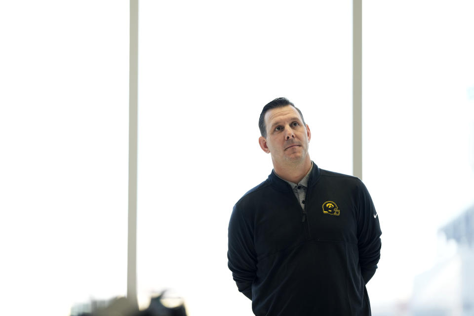 New Iowa offensive coordinator Tim Lester waits to speak at an NCAA college football news conference, Tuesday, Feb. 6, 2024, in Iowa City, Iowa. (AP Photo/Charlie Neibergall)