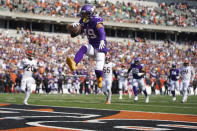 Minnesota Vikings wide receiver Adam Thielen (19) leaps into the end zone with the ball to score a touchdown in the third quarter of an NFL football game against the Cincinnati Bengals, Sunday, Sept. 12, 2021, in Cincinnati. (Andrew Souffle/Star Tribune via AP)