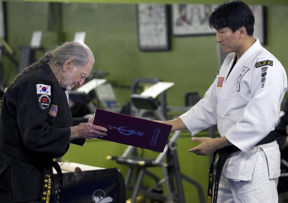 Willie Nelson, the country music icon who turns 81 this week, bows as he receives his fifth-degree black belt in the martial art of Gong Kwon Yu Sul on Monday, April 28, 2014, in Austin, Texas. (AP Photo/Austin American-Statesman, Ralph Barrera) AUSTIN CHRONICLE OUT, COMMUNITY IMPACT OUT, INTERNET AND TV MUST CREDIT PHOTOGRAPHER AND STATESMAN.COM, MAGS OUT