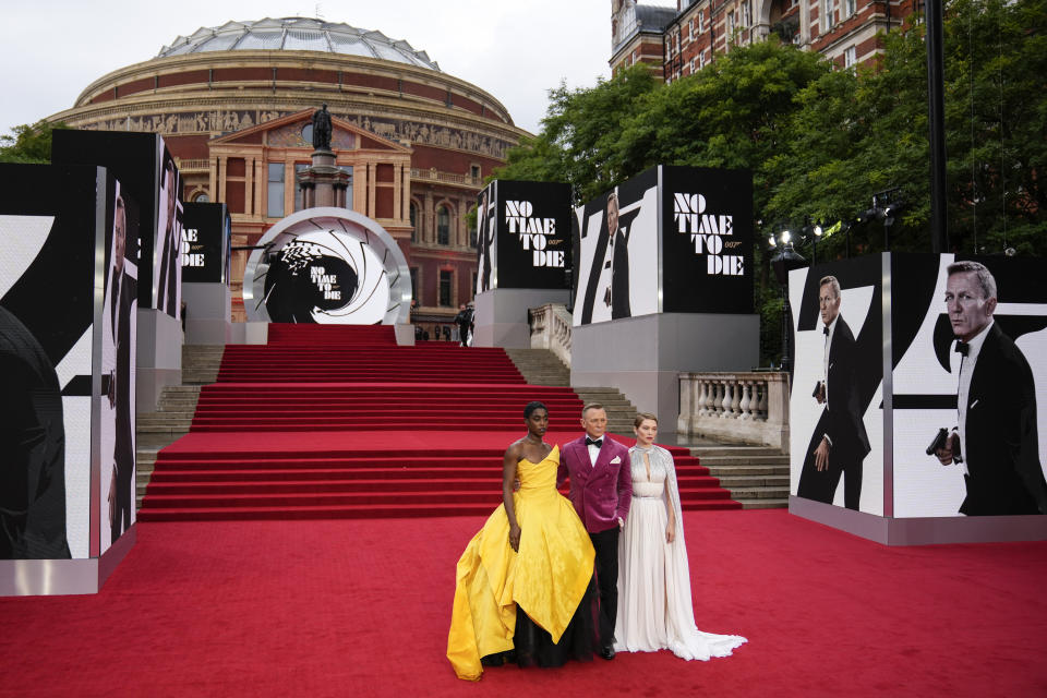 Lashana Lynch, from left, Daniel Craig and Lea Seydoux pose for photographers upon arrival for the World premiere of the new film from the James Bond franchise 'No Time To Die', in London Tuesday, Sept. 28, 2021. (AP Photo/Matt Dunham)