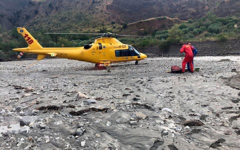 A rescue helicopter in the gorge that was hit by a flash flood - Credit: Francesco Arena/Ansa