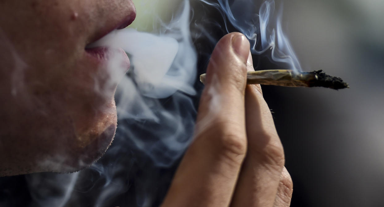 A person smoking marijuana (Getty Images)