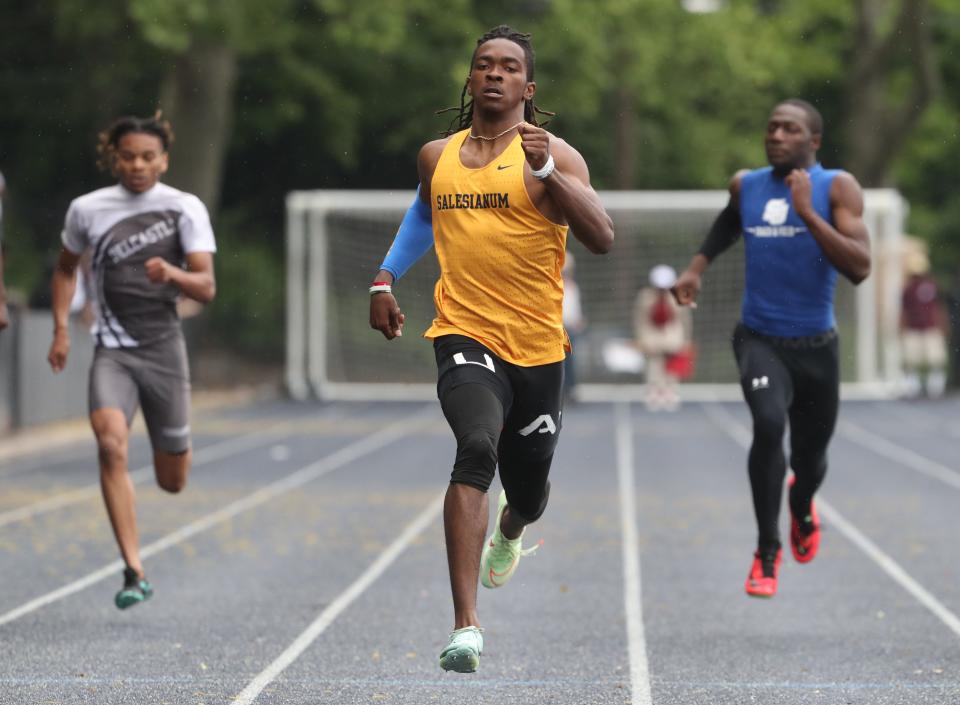 Salesianum's Jasyn Truitt wins the 200 meter dash during the New Castle County Track and Field Championships at Abessinio Stadium, Saturday, May 13, 2023. Truitt's 21.24 was a state record.