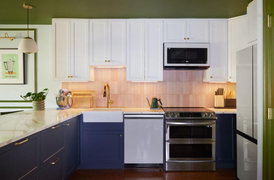 Even before David took up the design reins, Brooke had had the kitchen outfitted with cookie-cutter IKEA cabinetry. “The kitchen lacked the touches of her true personality,” David observes. His first order of affairs was bringing in a zellige tile backsplash and a pink-veined quartzite counter to soften the spartan scheme. He haloed the latter with gilt-edged Mitzi pendants to add a touch of sparkle.