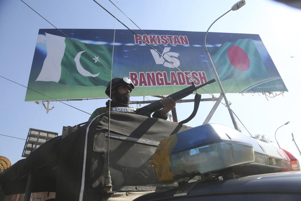 A security person stands guard outside the Gaddafi Stadium in Lahore, Pakistan, Friday, Jan. 24, 2020. Pakistan and Bangladesh play their first T20 of the three matches series under tight security. (AP Photo/K.M. Chaudary)