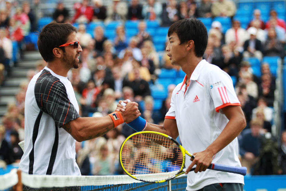 LONDON, ENGLAND - JUNE 15:  Janko Tipsarevic of Serbia (L) congratulates Yen-Hsun Lu of Taiwan after their mens singles third round match against on day five of the AEGON Championships at Queens Club on June 15, 2012 in London, England.  (Photo by Clive Brunskill/Getty Images)