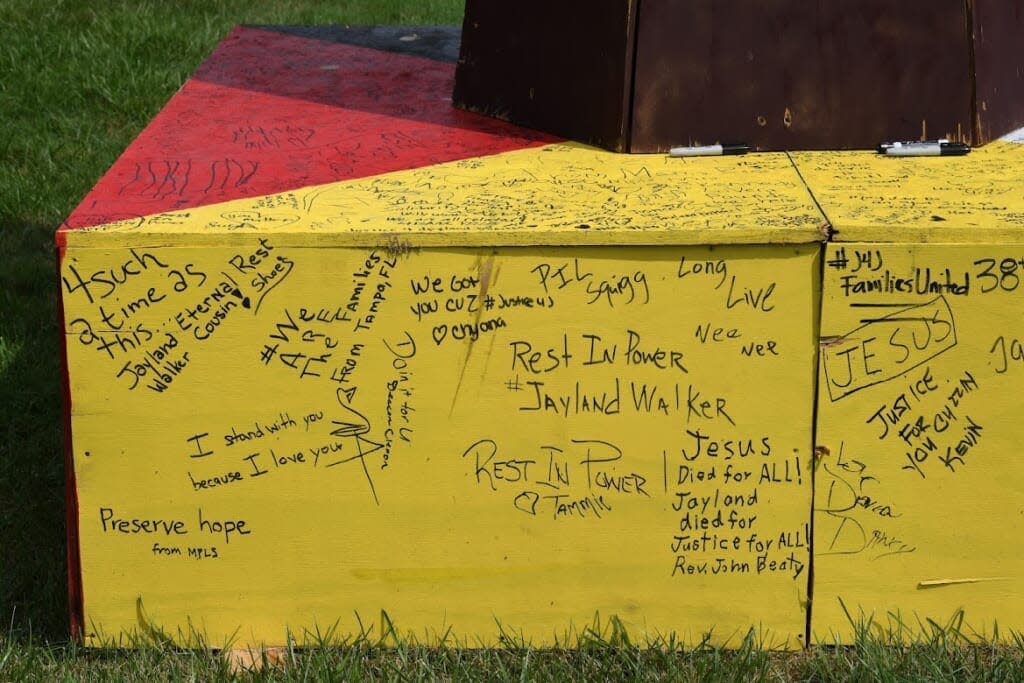 The base of a statue in Akron, Ohio contains messages for Jayland Walker. (Photo credit: Ken Love Photography)