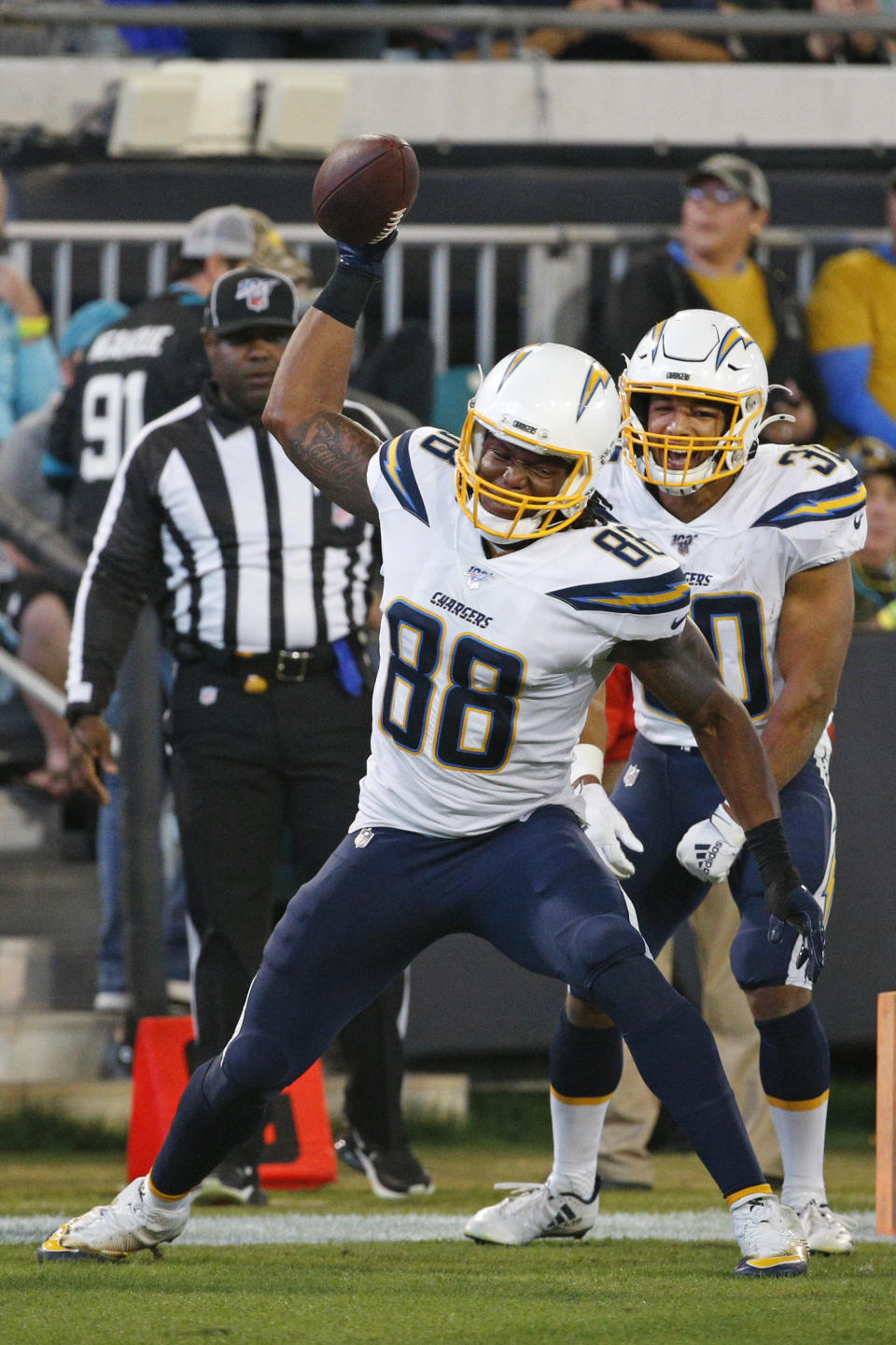 Los Angeles Chargers tight end Virgil Green (88) spikes the ball after scoring a touchdown against the Jacksonville Jaguars during the second half of an NFL football game, Sunday, Dec. 8, 2019, in Jacksonville, Fla. (AP Photo/Stephen B. Morton)