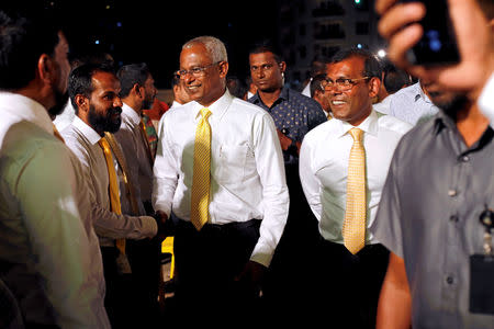 Maldives President Ibrahim Mohamed Solih and former president Mohamed Nasheed arrive at an election campaign rally ahead of their parliamentary election on Saturday, in Male, Maldives April 4, 2019. REUTERS/ Ashwa Faheem