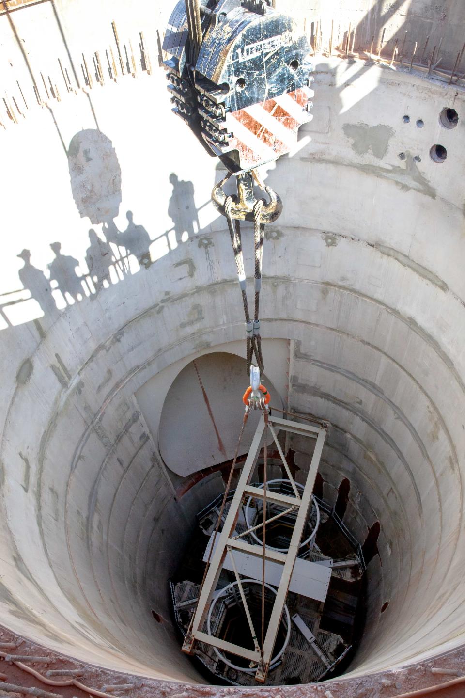 Workers sink a utility shaft at the Waste Isolation Pilot Plant.