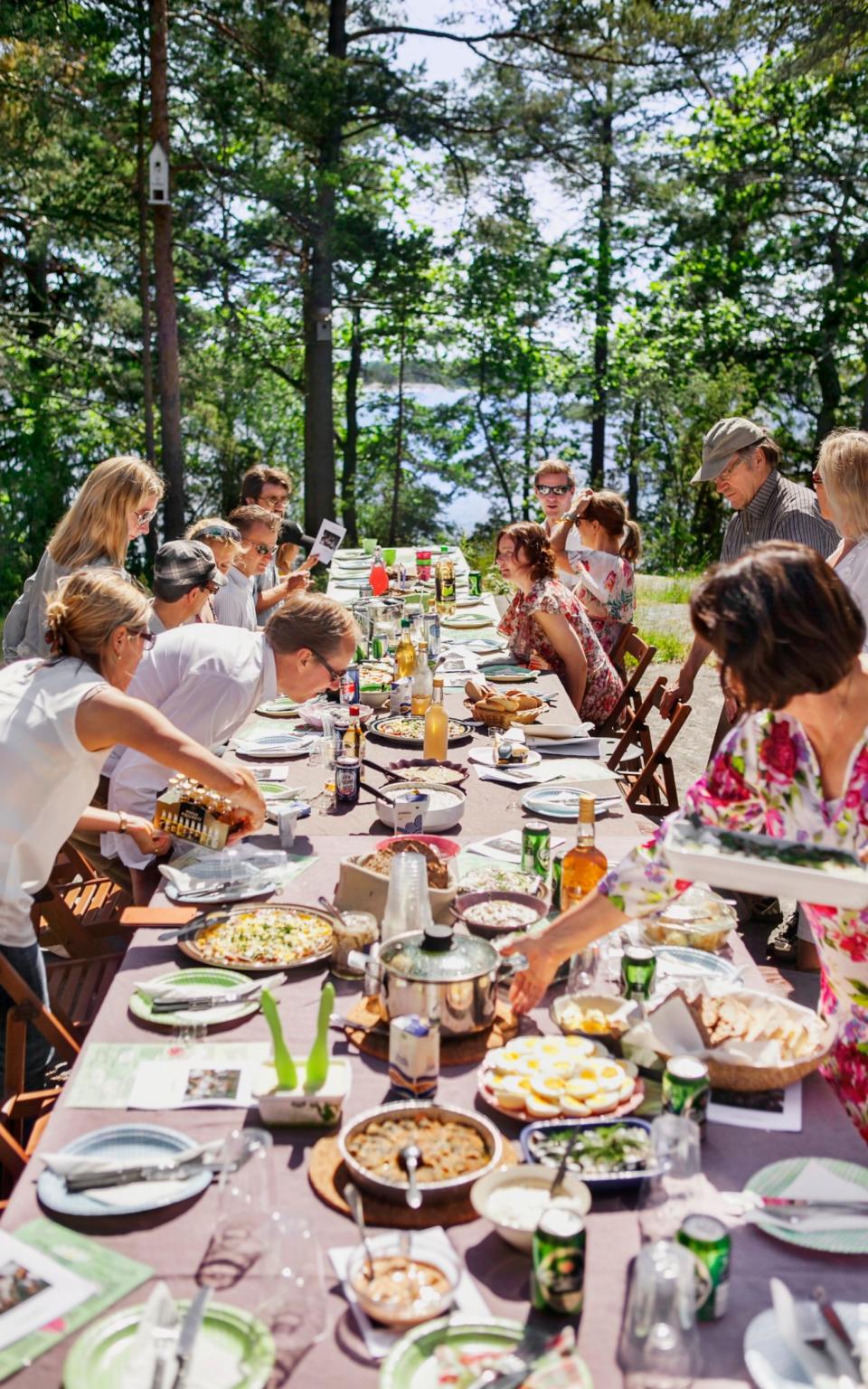 Midsummer feast outdoors - Credit: plainpicture/Johner