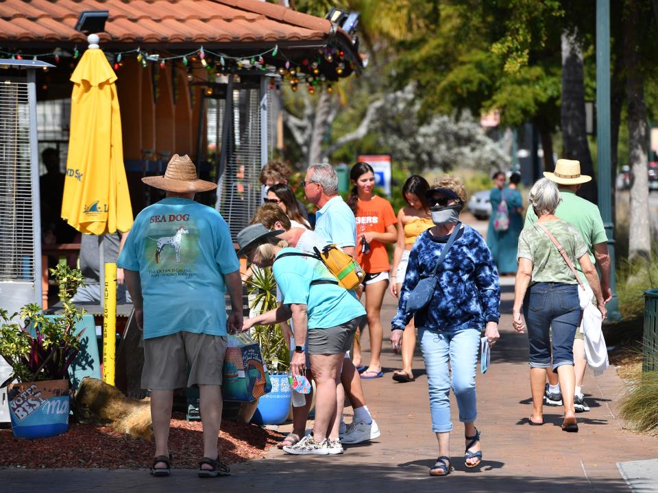 Visitors in Siesta Key Village in 2021.