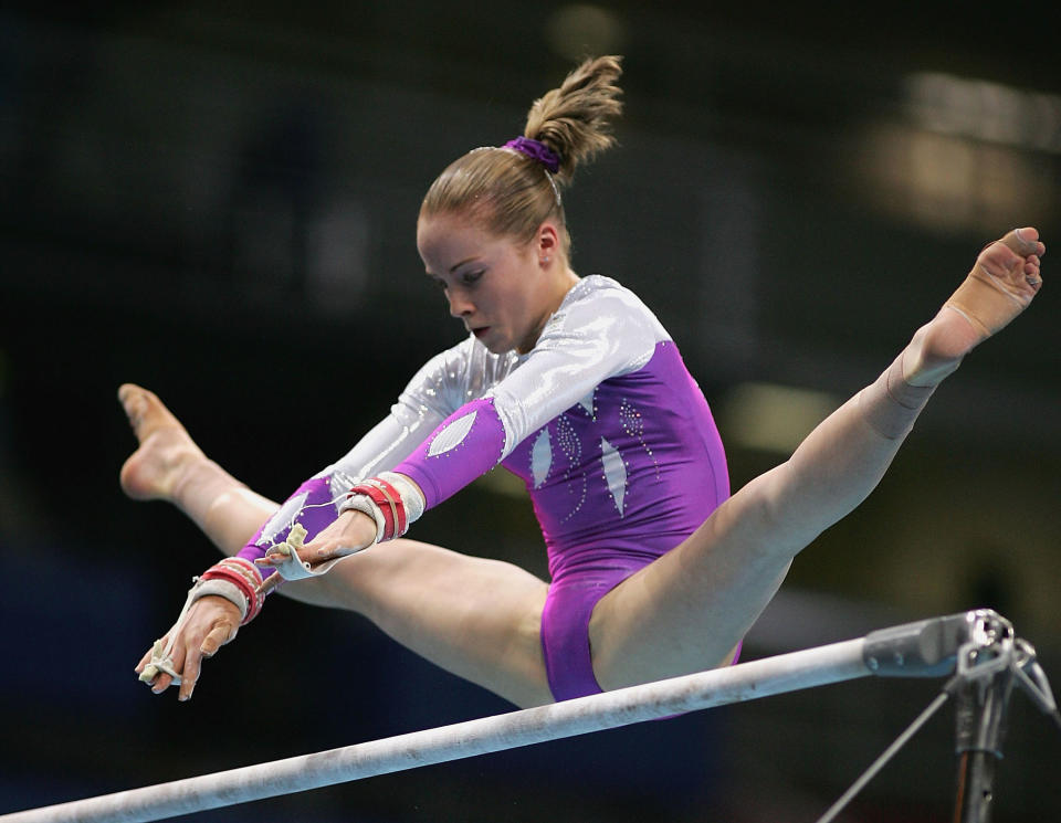 ...on the Uneven Bars in the qualification round of the team event at the w...