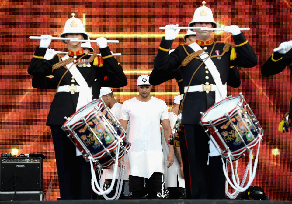 LONDON, ENGLAND - SEPTEMBER 14:  Ashley Banjo and Diversity with the Marine Band perform onstage during the Invictus Games Closing Concert at the Queen Elizabeth Olympic Park on September 14, 2014 in London, England.  (Photo by Samir Hussein/WireImage)