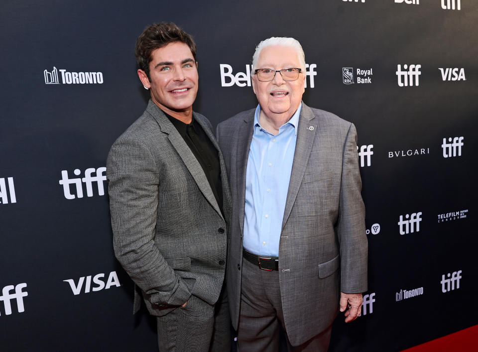 Efron (left), posed on the red carpet with John 