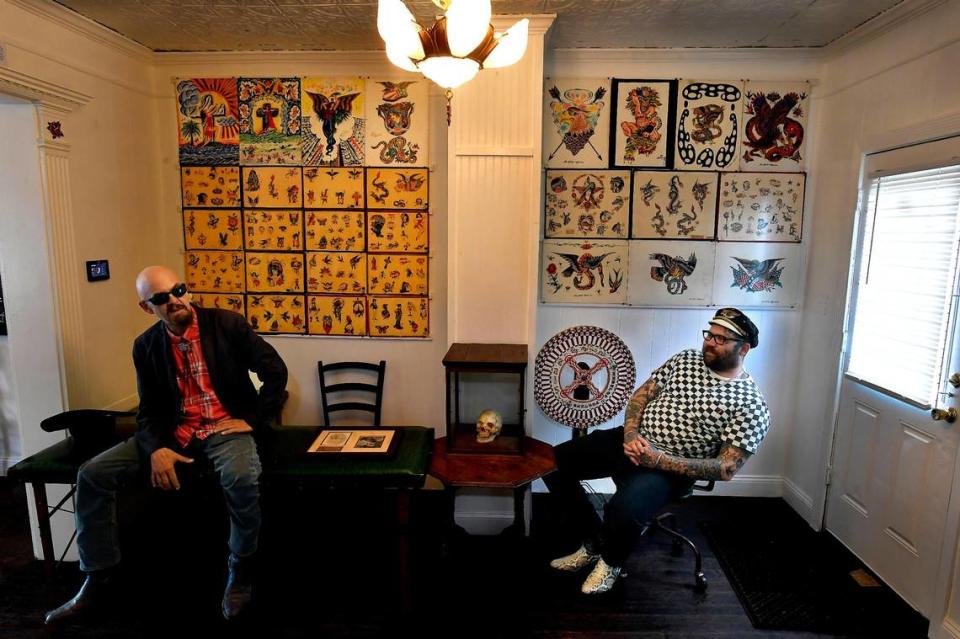 Davey Gant, right, was struck by the collection of tattooing instruments, photos and tattoo “flash” that Wes Grimm had acquired over the years. “The history of it just comes screaming at you when you see it all en masse,” Gant said. 