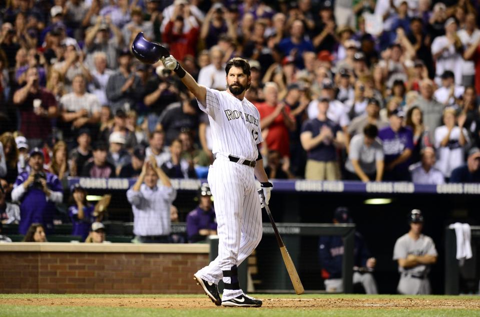 Sep 25, 2013; Denver, CO, USA; Colorado Rockies first baseman Todd Helton (17) tips his helmet in the second inning of the game against the Boston Red Sox at Coors Field. Mandatory Credit: Ron Chenoy-USA TODAY Sports ORG XMIT: USATSI-125060 ORIG FILE ID:  20130952_pjc_ac4_101.JPG